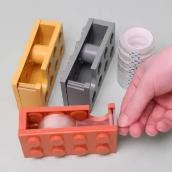 Резак для клейкой ленты Простое управление Ручной резак для клейкой ленты Дизайн игрушечных кирпичей Многоцелевой ручной резак для клейкой ленты Экономия труда